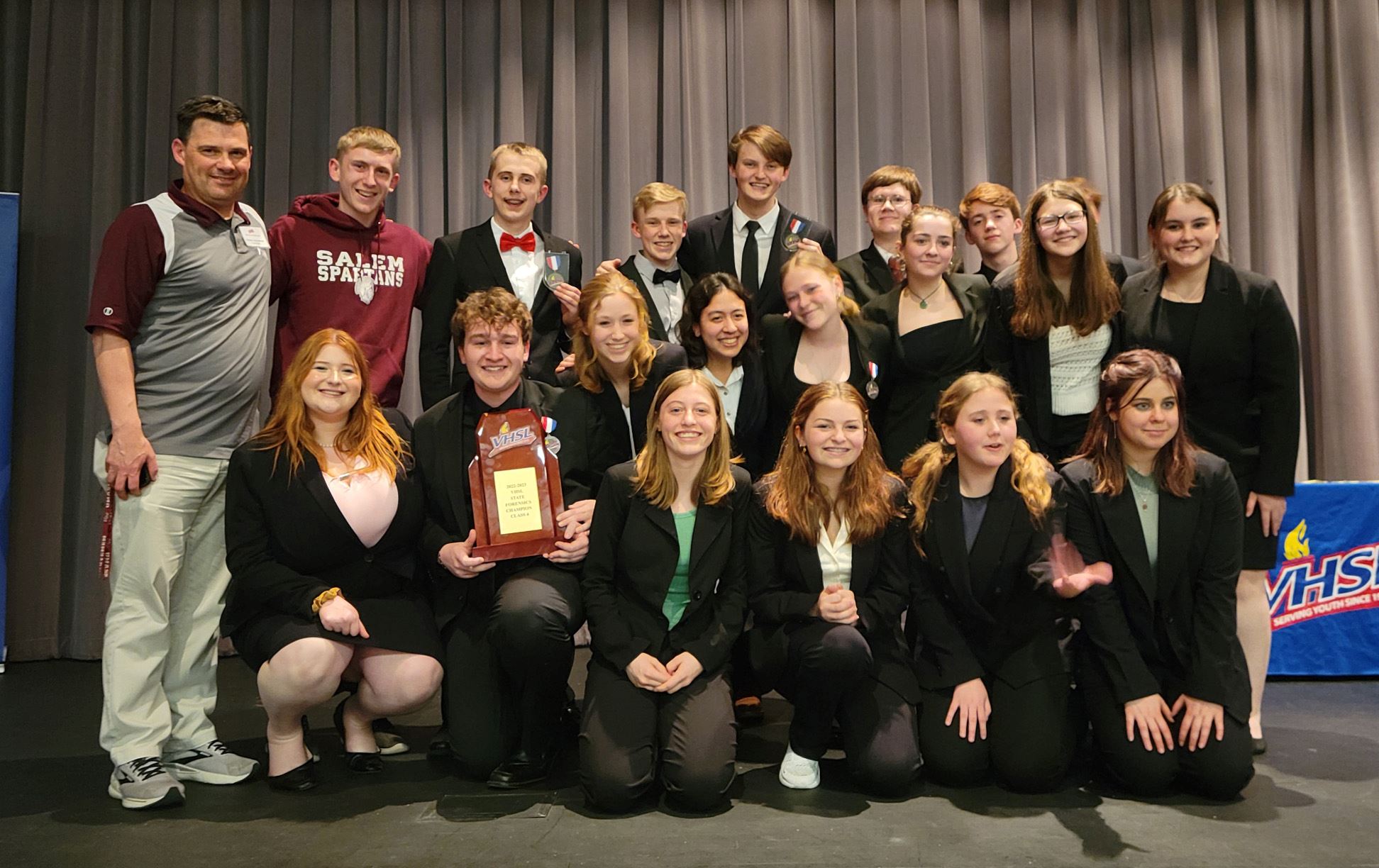 Photo of Salem High School Forensics team on a stage